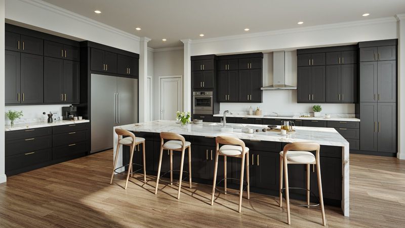 Black shaker kitchen cabinets with marble waterfall island
