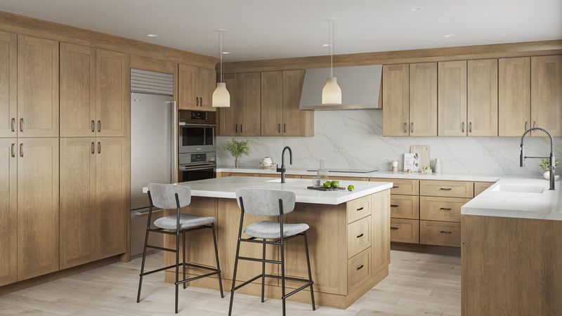 Natural oak shaker kitchen cabinets with white quartz island