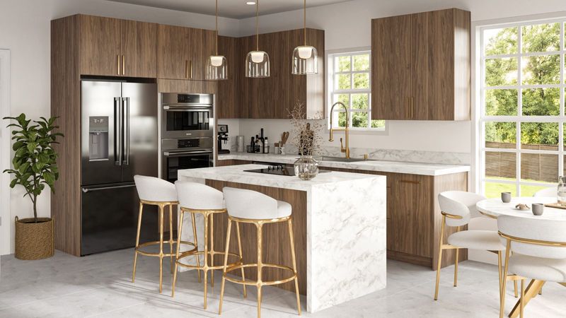 Modern walnut slab-door kitchen with marble island and gold stools