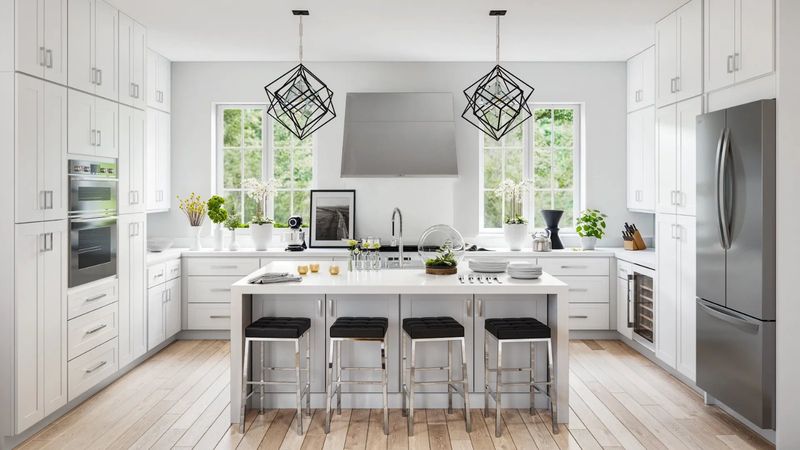 Classic white shaker kitchen with island and stainless appliances
